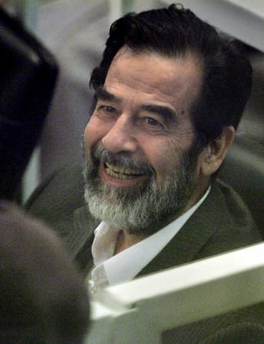 Another view of 'Saddam' at his trial in Baghdad yesterday. Note that he looks confident and assured, which maybe because he knows that he's getting a big pay-off for his act? Again, note those eyes, and the fact that he looks younger than in some other photos